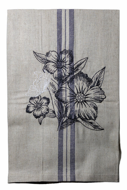 Dettaglio del ricamo Asciugapiatti ricamato con anemoni e farfalla della collezione Vintage Stripes Noir Botanique su fondo neutro.